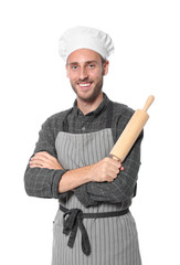 Professional chef holding rolling pin on white background
