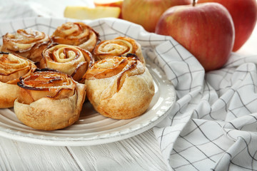 Naklejka na ściany i meble Rose shaped pastry with apple filling on plate