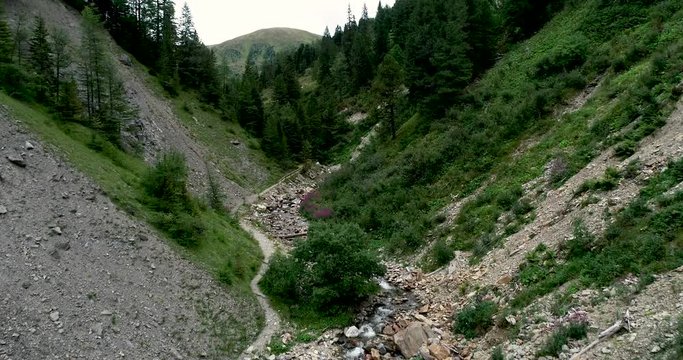 Drone flight in summer over mountain stream in the Nockberge mountains in the Thunder Gorge in Carinthia in innerkrems, lungau, schoenfeld