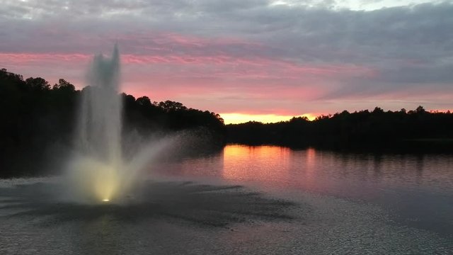Lake fountain at sunset, aerial