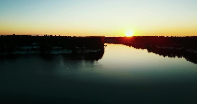 Aerial, sun sets over lake in North Carolina