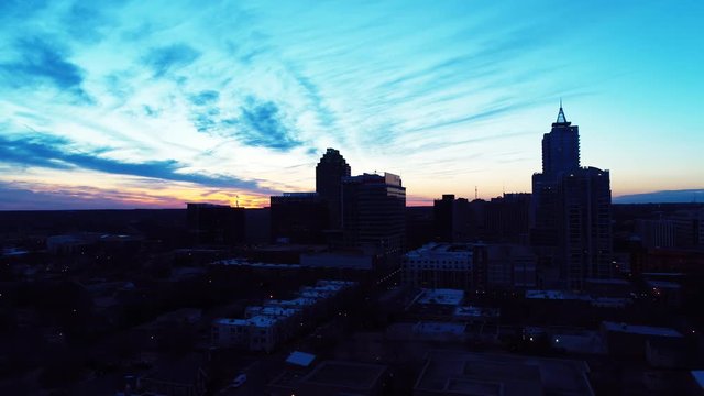 Wide aerial, Raleigh skyline at dusk