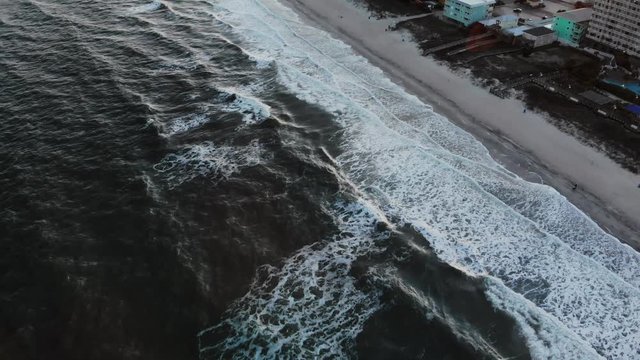 Waves crash on Carolina Beach, aerial