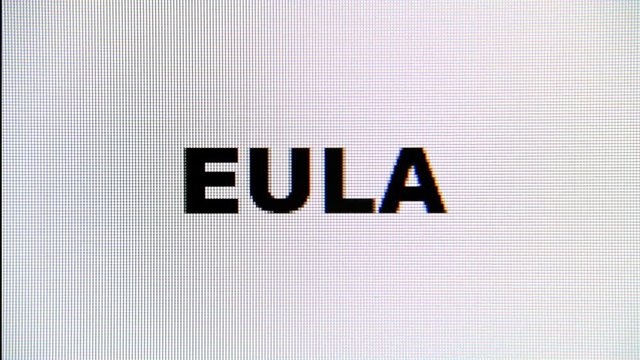 Typing the word EULA (end-user license agreement) on a computer monitor. Macro detail shot.

