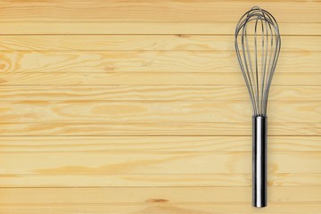 Stainless steel whisk isolated