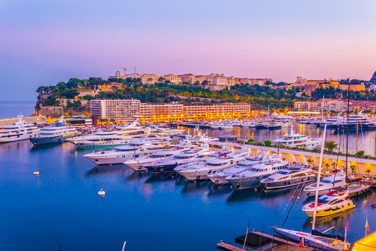Old town of Monaco overlooking port Hercule during sunset