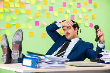 Businessman having trouble with his priorities