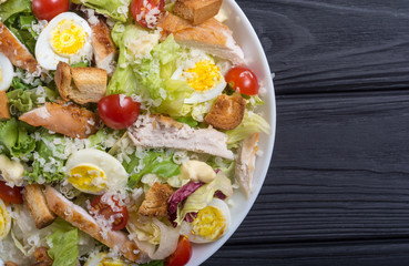 Salad ceasar with chicken , eggs and tomatoes