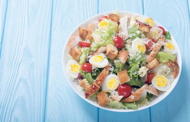 Salad ceasar with chicken , eggs and tomatoes