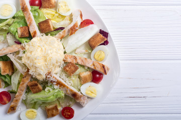 Salad ceasar with chicken , eggs and tomatoes