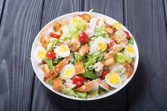 Salad ceasar with chicken , eggs and tomatoes