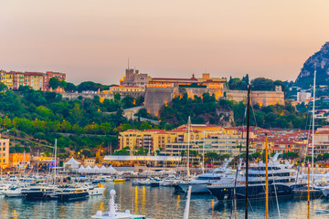 Old town of Monaco overlooking port Hercule during sunset