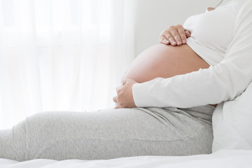 Strain of abdominal muscles during pregnancy, Preterm labor and pregnant women health concept