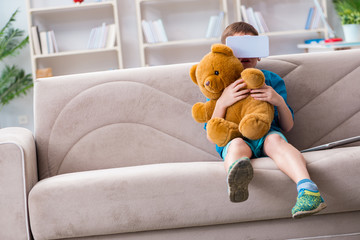 Young little boy with VR virtual reality glasses