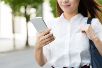 attractive asian woman using smart phone