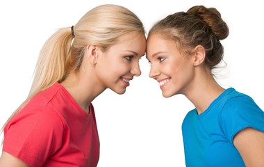 Portrait of Two Smiling Girlfriends / Sisters