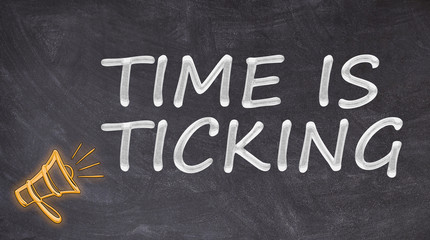 Fototapeta premium Time is ticking written on blackboard with megaphone