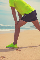 Exercising on a tropical sandy beach near sea / ocean.