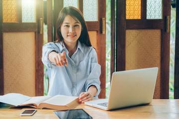 Beutiful asian business woman working with laptop, mobile phone, and tablet in vintage tone, stock...