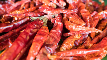 Fried dried chilli pepper Pile of dried chilli on sale in the market. Food ingradient