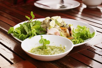 fresh spicy seafood on white plate