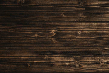 Fototapeta na wymiar Dark brown wood texture with natural striped pattern background