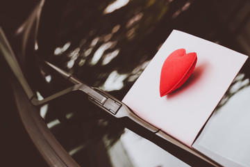 love letter heart on a sticky note under a windshield .vintage  color style