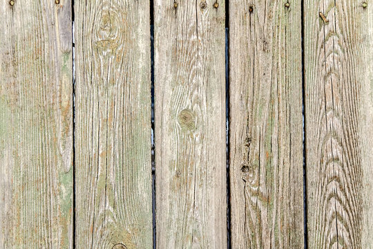 Old wooden planks in a fence as an abstract background