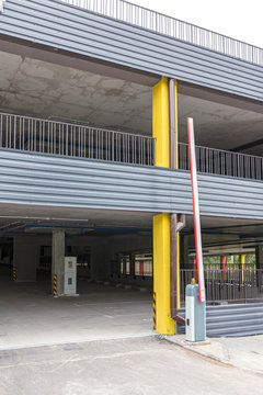 large empty multi-level parking garage with open driveway