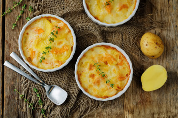 Pumpkin potato gratin with fresh thyme leaves