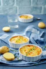 Pumpkin potato gratin with fresh thyme leaves