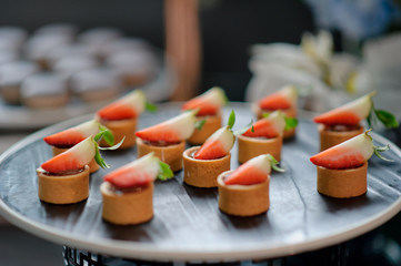 buffet food, catering food party at restaurant, mini canapes, snacks and appetizers