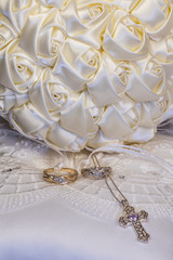 Ivory ribbon bridal bouquet on ring bearer's pillow with wedding rings