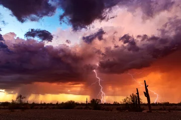 Photo sur Aluminium Orage Dramatic sunset sky with storm clouds and lightning.