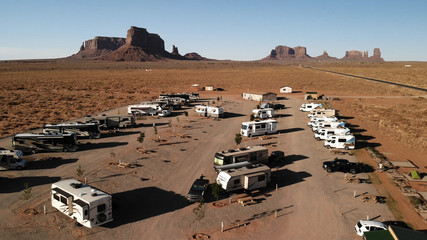 Utah, United States - July 9, 2018: RV park (campground) near the Oljato–Monument Valley, Utah. Aerial view, from above, drone shooting. Arizona - Utah border. Sunset