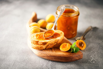 Jam in a jar and fresh fruits
