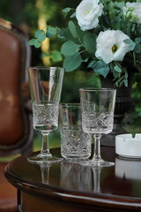 crystal glasses on a dark wooden table