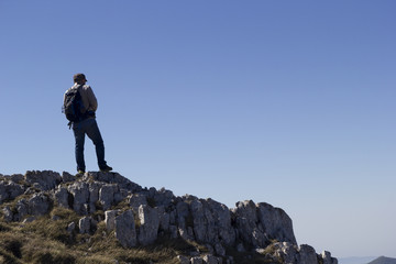 Hiker on the summit of a mountain
