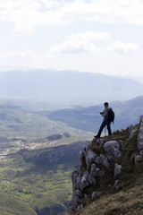 Fototapeta premium Hiker on the summit of a mountain