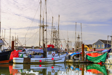 fishing boats on the quay in the fishing boats on the quay in the village of steveston