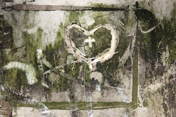 Hearts scribbled on a very dirty surface