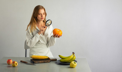 girl checks vegetables on the table