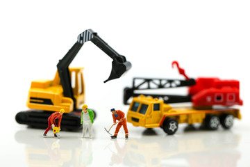 Miniature people : worker team for building home ,Image use for construction, business or Building and Code Staff Appreciation Day concept,house repair or home renovating