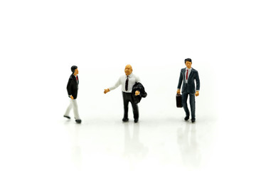 MIniature people : Businessman look a watch using for concept of time and Be Late For Something Day.