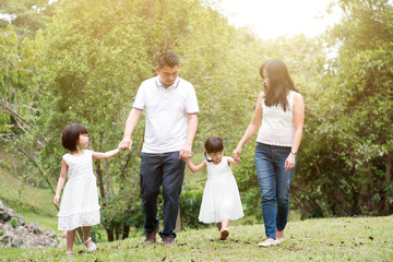 Fototapeta premium Happy family walking at outdoors