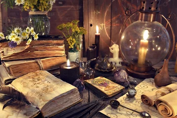 Foto op Canvas Still life with old-fashioned lamp, magic witch books, tarot cards and old papers. Mystic background with ritual esoteric objects, occult, fortune telling and halloween concept © samiramay