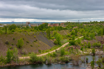 Fototapeta na wymiar View of disused opencast sandstone quarry. Russia, Rostov-on-Don region