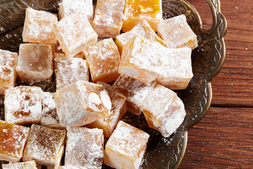 Turkish delight on a wooden table.