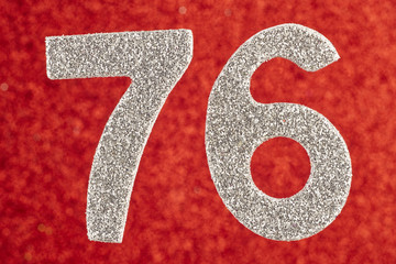 Number seventy-six silver color over a red background. Anniversary. Horizontal