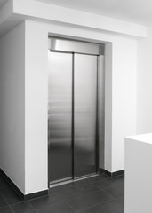 Modern lift in building, Hallway with elevator doors, New interior with stainless steel elevator